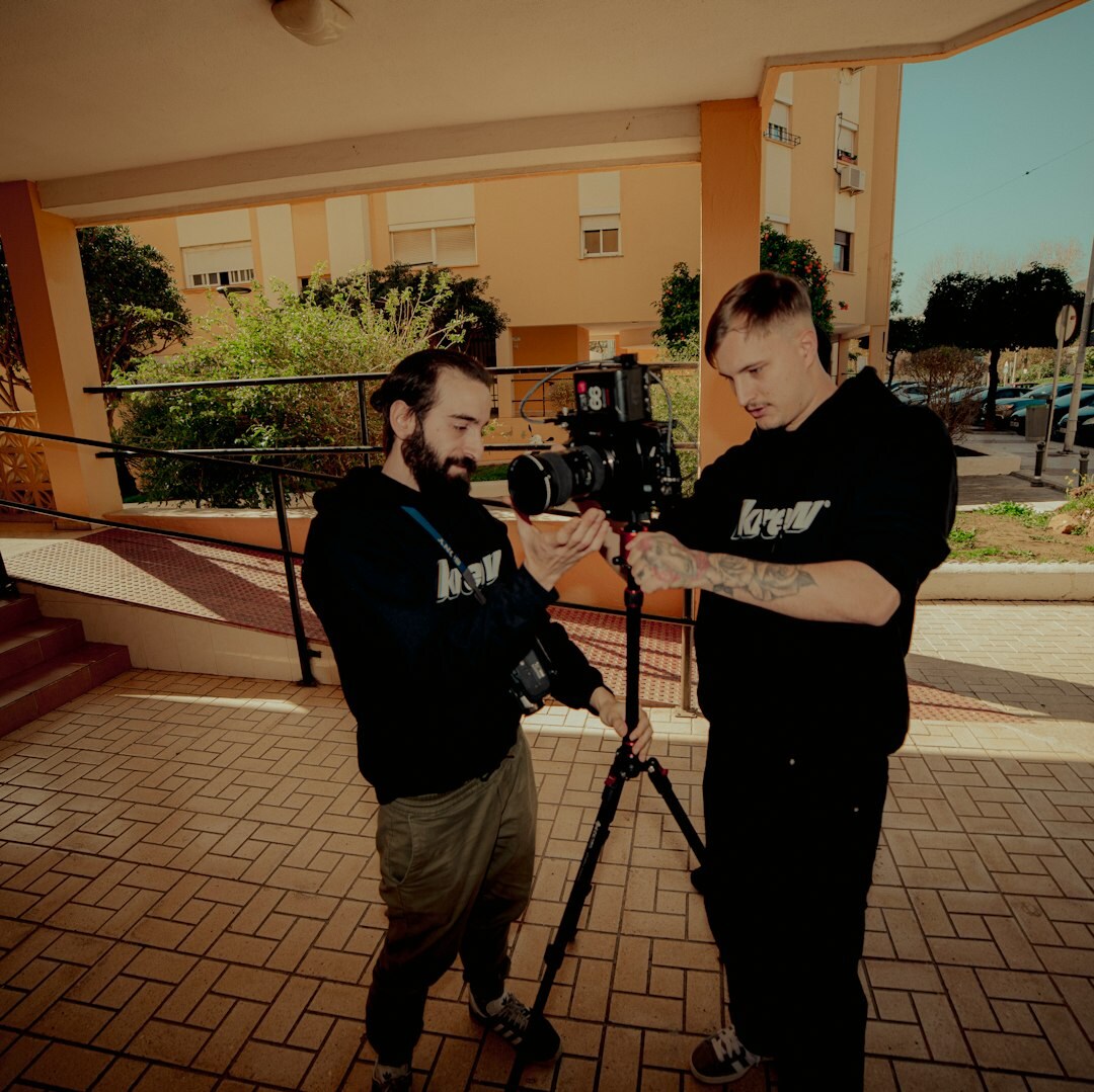 Small video team reviewing footage together on a monitor