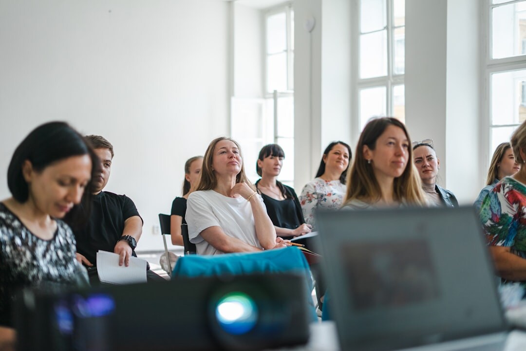 Small group watching a video presentation on a screen