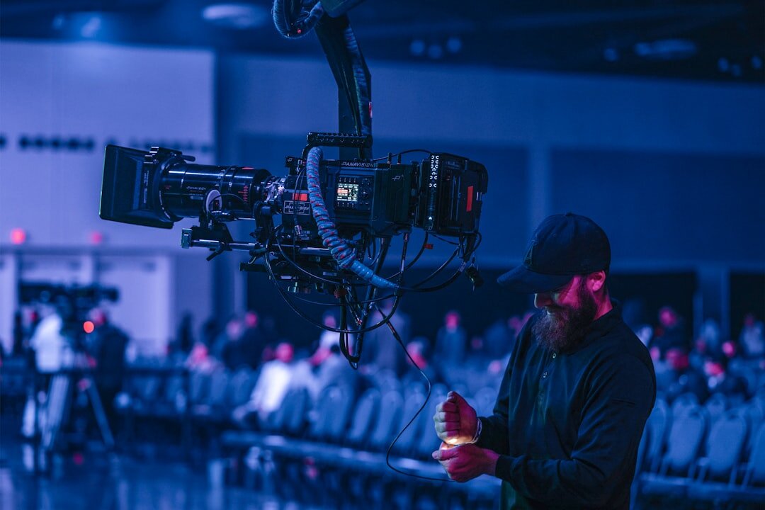 Camera operator filming a crowd during a live event