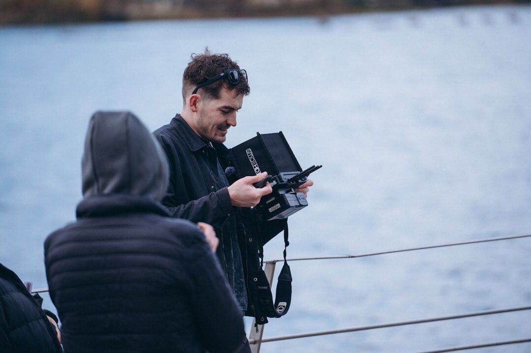 Group photo of a small video production team outdoors with equipment